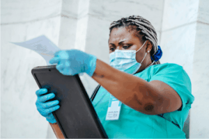 A nurse checking a chart, The true dangers of traditional cleaners