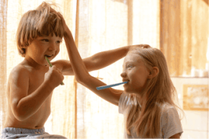 Siblings sharing a bathroom