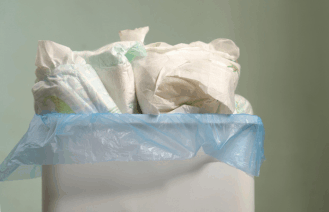 trash can full of diapers, conquer diaper trash odors