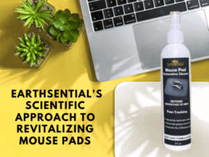 a clean mouse pad, a laptop and a bottle of Mouse Pad restorative cleaner from earthsential