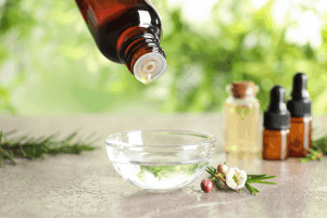 measuring out essential oils to the proper dilution