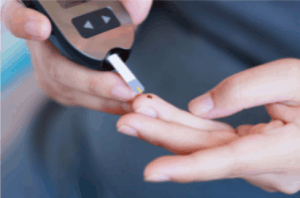 pricking a finger to check blood sugar for diabetes