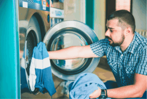 How to Clean a Messy House with Ease 2 doing laundry