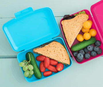 Lunchbox Care 101: The Art of Keeping it Cleantwo lunch boxes fulled with yummy lunch, a sandwich, grapes and some vegi's