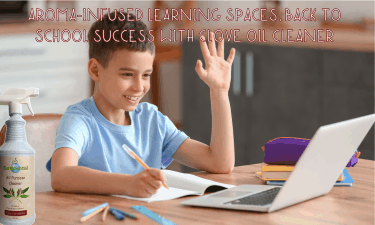 a student studying at his laptop with a bottle of Clove all purpose cleaner by EarthSential