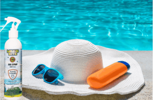 A sunny day by the pool, with a sun hat, sun glasses, sun screen and Minus Bite all natural bug spray