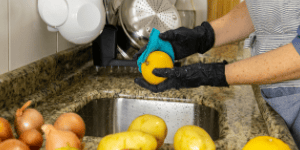 cleaning fruit with a microfiber cloth and all natural fruit and veggie wash