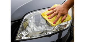 someone wiping a l cars headlight with a micro fiber cloth, Shine Bright: Headlight Cleaning Tips