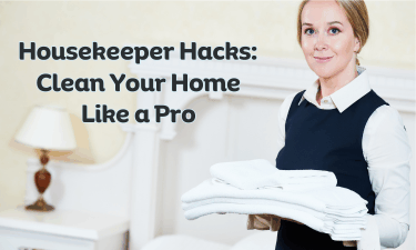 a housekeeper holding a stack of folded towels