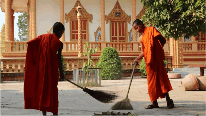 2 monks sweeping the meditation center. Cleansing the meditaion center, preparing the mind