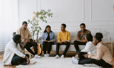 a gathering of friends in a clean living room. social acceptance and cleanliness