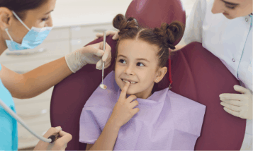 A child at the dentist. why dentist offices should only use natural cleaners